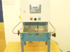 Single-purpose machine for lubricating headrest bars